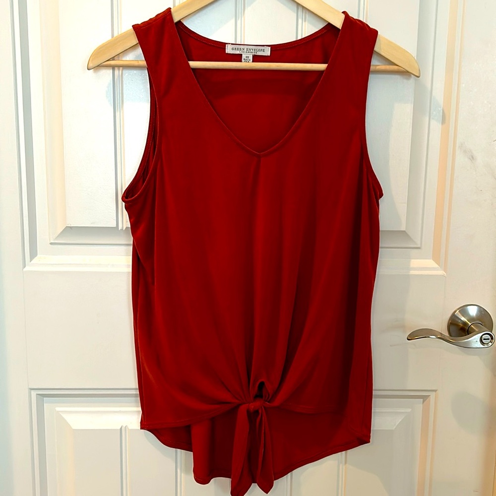 Sleeveless rust colored top. Size XS